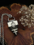 Pendentif d'Ébène et d'Argent