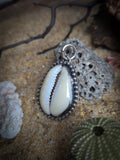 Pendentif cauris